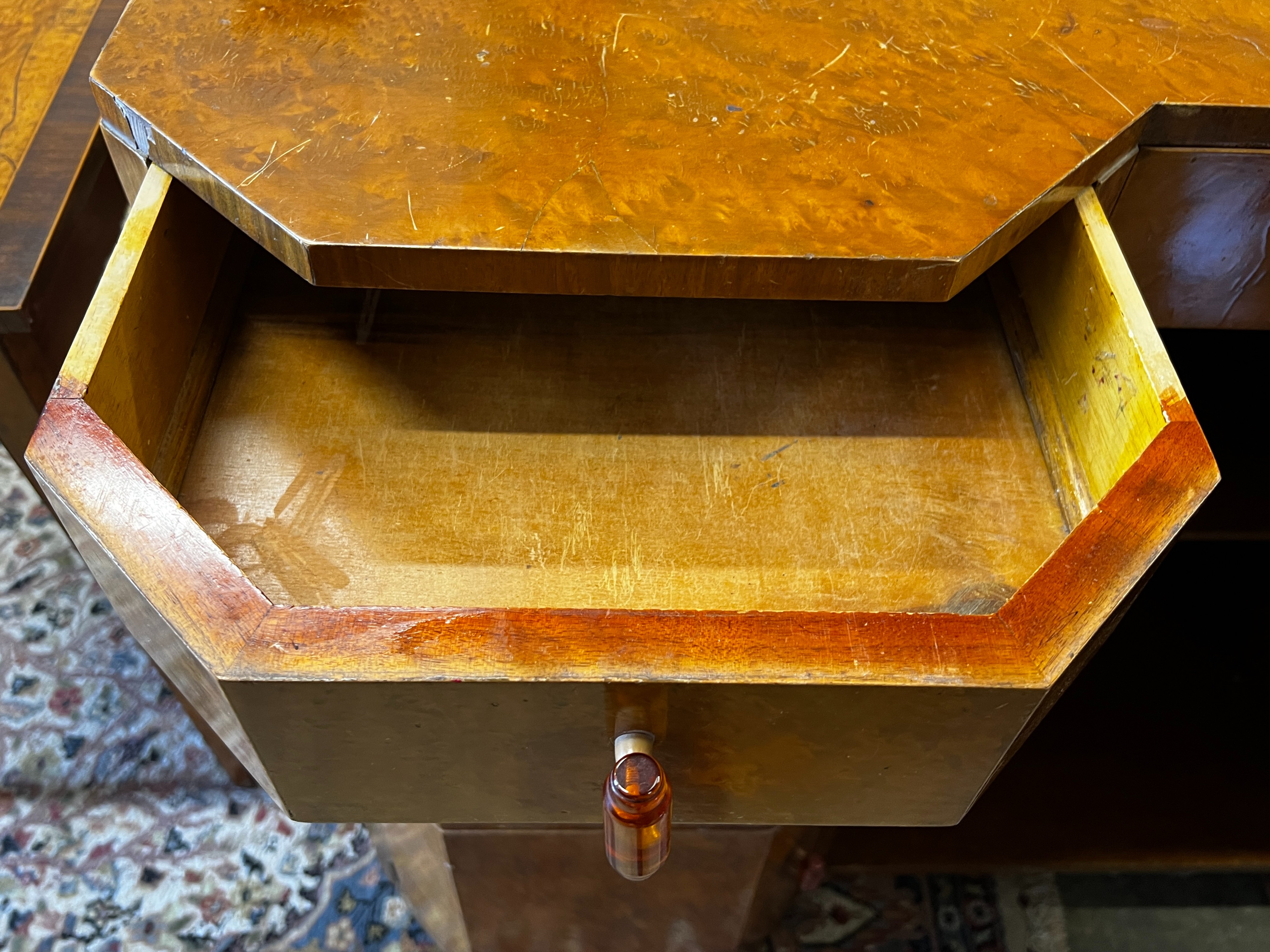 A French Art Deco bird's eye maple side cabinet, width 137cm, depth 51cm, height 97cm